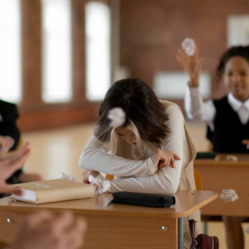 image of a teenager being bullied in school and does not know what to do